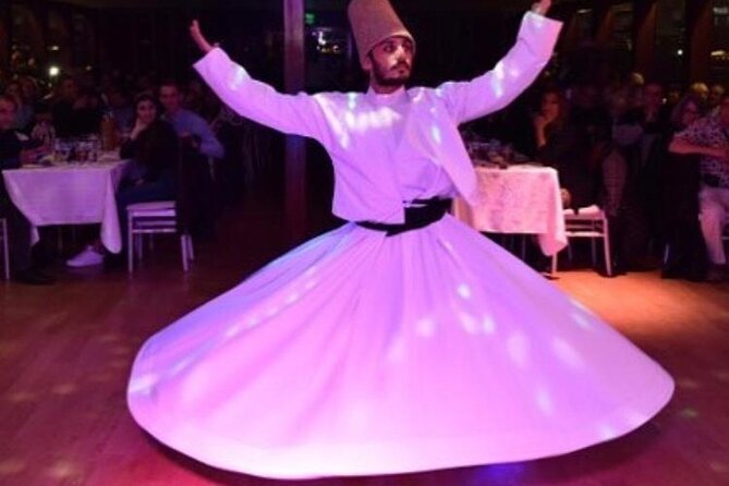 Bosphorus Dinner Cruise & Live Show – Private Table - Dolmabahçe Palace by night: architect details and Atatürk’s last days